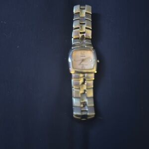 Ladies Lorus Quartz watch.  Pink face. Keeps excellent time.